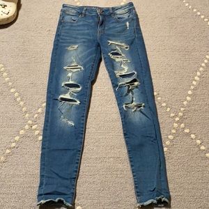American eagle skinny jeans with some patched rips, size 4